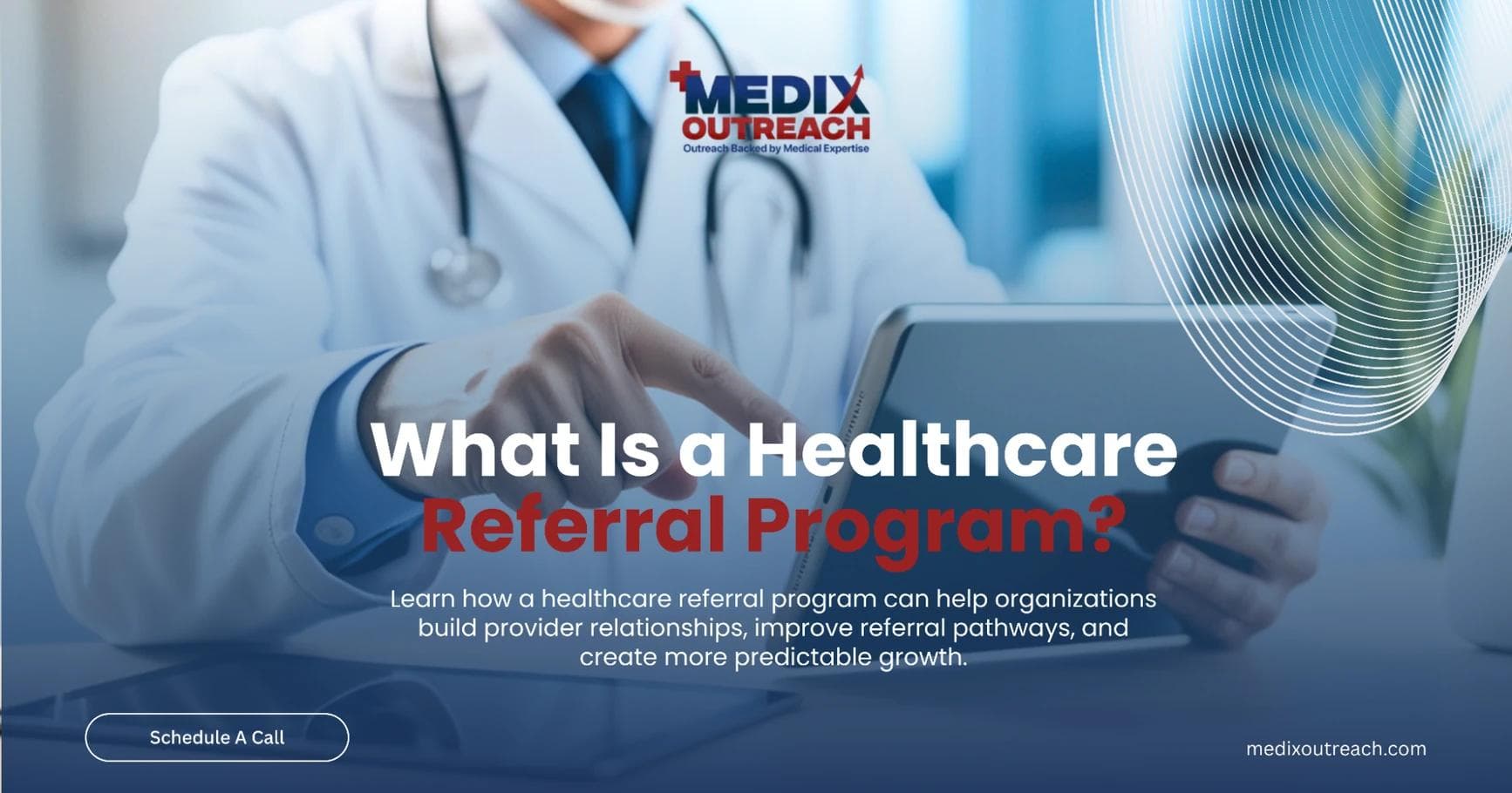 A clinician holding a tablet while reviewing healthcare referral information.